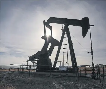  ?? JEFF MCINTOSH THE CANADIAN PRESS FILE PHOTO ?? A pumpjack works at a well head near Cremona, Alta. The use of flow-through shares fuelled investment in Canada’s mining, oil and gas, and renewable energy sectors over the past half-century. Technology companies should follow suit, Don Tapscott writes.