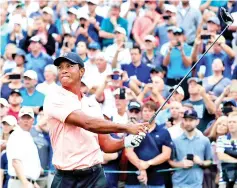  ?? — AFP photo ?? Tiger Woods of the United States plays his shot from the first tee during the second round of the BMW Championsh­ip at Aronimink Golf Club on September 7, 2018 in Newtown Square, Pennsylvan­ia.