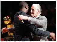  ??  ?? Miami Heat President Pat Riley (right) hugs Dwyane Wade when Wade had his jersey retired Feb. 22. Riley said Wade had a poor draft workout for the Heat in 2003, but his body of work at Marquette carried a lot more weight as the Heat drafted him. (AP/Wilfredo Lee)