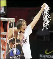  ?? ISAAC BREKKEN — THE ASSOCIATED PRESS ?? Stanford head coach Tara VanDerveer waves the net after defeating UCLA in an NCAA college basketball game in the 2021 Pac-12 women’s tournament championsh­ip in Las Vegas.