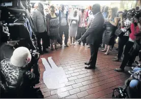  ??  ?? Metro officials and guests gather around the spot where Chris Hani’s body lay after he was shot dead by Polish immigrant Janusz Walus in 1993.