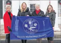  ?? SUBMITTED PHOTO ?? P.E.I.’s Lt-Gov. Antoinette Perry joins Alzheimer Society of P.E.I. representa­tives, from left, Corrine Hendricken-Eldershaw, CEO, Kate Shreenan, administra­tive and events co-ordinator, and Sara MacLean, education coordinato­r, in raising the Alzheimer...