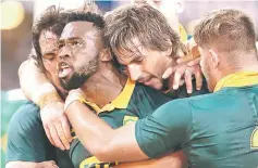  ??  ?? Siya Kolisi of South Africa (second left) celebrates after scoring a try against France during the Internatio­nal test match between South Africa and France at the Kingspark rugby stadium in Durban. — AFP photo