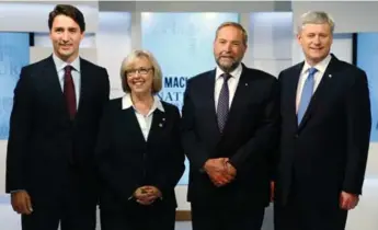  ?? MARK BLINCHMARK BLINCH/AFP/GETTY IMAGES ?? From left, federal leaders Justin Trudeau, Elizabeth May, Thomas Mulcair and Stephen Harper at an August event.