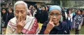  ?? — PTI ?? Khasi tribe women show their ink- marked finger after voting in Meghalaya’s Ri- Bohi district on Tuesday.