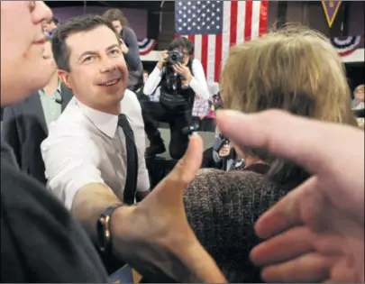  ??  ?? PETE BUTTIGIEG prema prvim je rezultatim­a osvojio 26,8 posto glasova, a Bernie Sanders (dolje lijevo) 25,2 posto, treća je Elizabeth Warren s 18,4, a Joe Biden četvrti sa svega 15,4 posto podrške