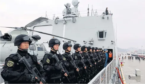  ?? REUTERS ?? Soldiers of the Chinese People’s Liberation Army stand on the deck before a fleet sets out for Yemen to help evacuate foreign nationals during an explosion of political violence there.