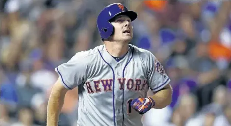  ?? THE ASSOCIATED PRESS FILES ?? Jay Bruce watches his solo home run off Colorado Rockies relief pitcher Chris Rusin during an Aug. 1 game in Denver. The Cleveland Indians acquired the slugger from the New York Mets on Wednesday for minor league pitcher Ryder Ryan.