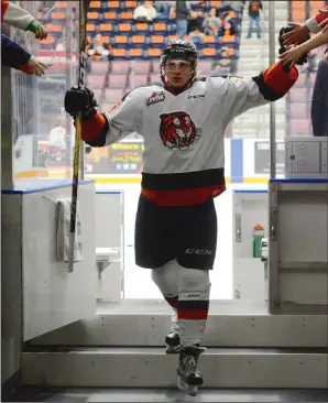  ?? NEWS PHOTO RYAN McCRACKEN ?? Medicine Hat Tigers winger Mark Rassell gets some kudos from fans following warmup of Game 1 in the Western Hockey League’s Eastern Conference quarter-final series against the Brandon Wheat Kings at the Canalta Centre on March 24. Rassell was named...