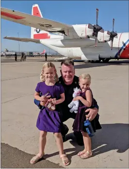  ?? Courtesy photo
/ Kristopher Albrecht ?? Kristopher Albrecht (center) at work with the U.S. Coast Guard in Sacramento during a 2018 visit from his daughters Korrah (left) and Charlize (right).