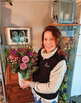  ?? ?? Flower power Talented florist Becky Lindl was delighted to win her award