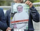  ?? Picture: REUTERS / OSMAN ORSAL ?? LEST WE FORGET: A demonstrat­or holds a picture of Saudi journalist Jamal Khashoggi during a protest outside the Saudi Arabian consulate in Istanbul, Turkey.