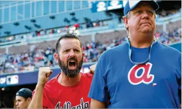  ?? CURTIS COMPTON / CCOMPTON@AJC.COM ?? Some fans were yelling while others were more muted at SunTrust Park after the Braves were stunned by a 10-run first inning to put St. Louis in command early in the deciding Game 5 of the playoff series.