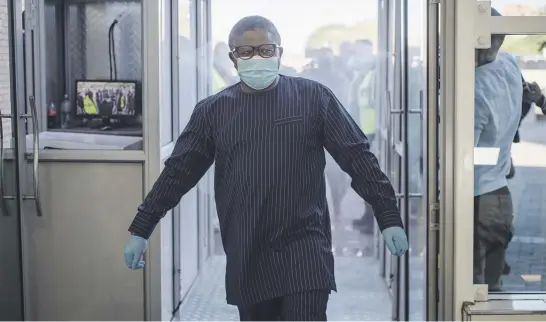  ?? Picture: Jacques Nelles ?? Transport Minister Fikile Mbalula walks through the electronic sanitising station during his inspection of Gautrain’s readiness to transport commuters on the first day of operations during Level 4 of the lockdown in Pretoria yesterday.