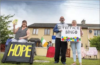  ?? Helen Geary with Aidan and Breda Duggan during last weekend’s street bingo session in Ardfert. ??