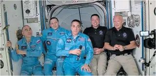  ?? NASA ?? NASA astronauts Doug Hurley (from right) and Bob Behnken join NASA astronaut Chris Cassidy and Russian cosmonauts Ivan Vagner and Anatoly Ivanishin aboard the Internatio­nal Space Station after successful­ly docking Spacex's Dragon capsule on Sunday.