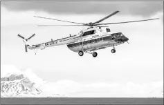  ??  ?? A view shows the Russian-made Mil Mi-8 helicopter, that went missing with eight people aboard off the coast of the Arctic Svalbard archipelag­o, in the settlement of Barentsbur­g on Svalbard, Norway.