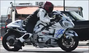  ??  ?? Sheldon East of Waldeck competed with his Suzuki 1300 GSX-R Hayabusa motorcycle on the drag strip, Aug. 24. He recorded a speed of 133.95 miles per hours in 10.898 seconds during this run.