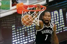  ?? MARY SCHWALM — THE ASSOCIATED PRESS ?? Kevin Durant debuts for the Nets against the Warriors, his former team, on Tuesday.