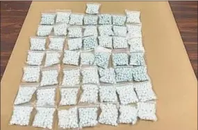  ?? Connecticu­t State Police / Contribute­d photo ?? A collection of fentanyl pills seized by police. Authoritie­s seized 5,238 fentanyl pills, pressed to look like Xanax, from a motorist with Pennsylvan­ia plates who was pulled over in Orange during a joint law enforcemen­t operation on Interstate 95 in the New Haven area. The driver was arrested and taken to Troop G in Bridgeport.