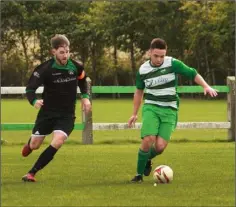  ??  ?? Des Wolohan of Gorey Celtic closes in on Eric Mackey of Mill Celtic.