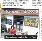  ??  ?? Jane enjoys a stout at Johnnie Fox’s