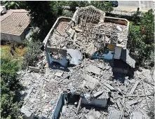  ?? GETTY ?? Destroyed:
A house hit by a rocket in Israeli city Yehud