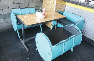  ?? RICHARD WHITE ?? Regrub features unique seating in the district’s funky go-to burger place.