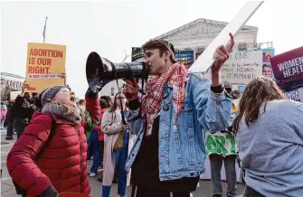  ?? Jose Luis Magana/Associated Press ?? Activists rally Tuesday outside the Supreme Court as justices hear arguments over the availabili­ty of a medication used last year in nearly two-thirds of U.S. abortions.