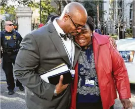  ?? Leroy Burnell / The Post and Courier via Associated Press ?? The Rev. Eric Manning, Emanuel AME’s new pastor, said his parishione­rs still meet for Bible study in the same room to share bread and water in what they refer to as the “love feast.” “Love still continues to prevail,” Manning said.