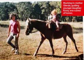  ??  ?? Mucking in: mother Glenda, guiding younger daughter Kirsty, was scared of horses.