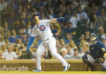  ?? SANCHEZ/CHICAGO TRIBUNE ARMANDO L. ?? Cubs catcher Willson Contreras hits an RBI double in the sixth inning against the Brewers at Wrigley Field on May 31.