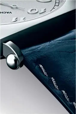  ??  ?? This and facing pages: the platinum and silk thread stitching on the dark blue alligator strap constitute­s a final refined detail
of the American 1921 Collection Excellence Platine.