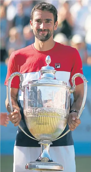  ??  ?? Marin Cilic celebrates his Queen’s Club win yesterday.