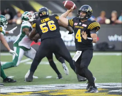  ?? CANADIAN PRESS FILE PHOTO ?? Hamilton Tiger-Cats quarterbac­k Zach Collaros (4) passes during the first half last Saturday. Collaros was outstandin­g in the contest.