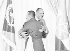  ?? — Reuters photo ?? File photo of shows Abiy and Isaias embracing each other at the declaratio­n signing in Asmara, Eritrea.