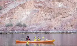  ?? K.M. Cannon Las Vegas Review-journal @Kmcannonph­oto ?? Jonathan Boyles and Dayana Garcia, both of Las Vegas, kayak on the Colorado River in Black Canyon at the base of Hoover Dam on July 30.