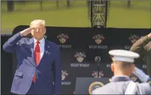  ?? David Dee Delgado / Getty Images ?? President Donald Trump salutes cadets at the beginning of the commenceme­nt ceremony on Saturday in West Point, N.Y.