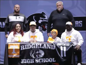  ?? Scott Herpst ?? Ridgeland senior Phillip Mason signed papers to continue his football career at the University of Tennessee last week. Among those on hand for the ceremony were Brittney Mason, Bryce Graves, Terrance Graves, and Ridgeland coaches Lebron Williams and Kip Klein.