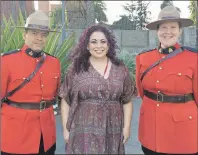  ?? KERRI DIXON SHEPPARD/SPECIAL TO THE GUARDIAN ?? Chef Ilona Daniel is shown with two Mounties prior to the Canada 150 celebratio­ns at the Canadian Embassy in Addis Ababa.