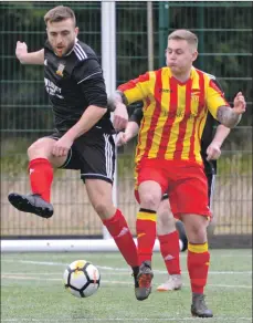  ??  ?? Dave Forbes challenges for the ball.