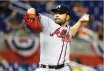  ??  ?? Braves starting pitcher Jaime Garcia throws during the first inning of Wednesday’s game.