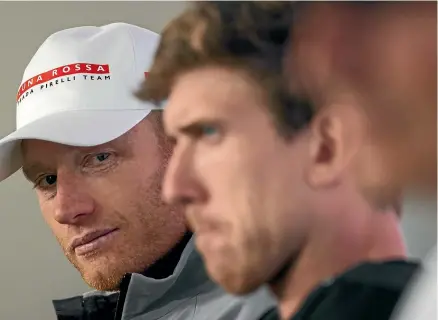  ??  ?? Jimmy Spithill, left, casts an eye towards Peter Burling at a media conference. Spithill has never been shy to launch a dig at his rivals and may do so again as the two prepare to square off in the America’s Cup finals series.