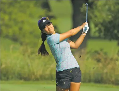  ?? Scott Halleran/Getty Images ?? Danielle Kang shot a 5-under 66 in the second round to claim a share of the lead with Sei Young Kim. They are a shot ahead of four others at the KPMG Women's PGA Championsh­ip at Olympia Fields Country Club in Illinois.