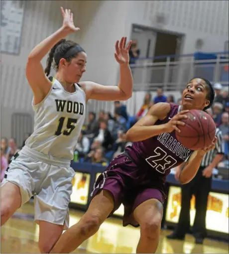  ?? PETE BANNAN — DIGITAL FIRST MEDIA ?? West Chester Henderson’s Adrienne Smith (23) looks to shoot as Archbishop Wood’s Annie Whalen (15) defends in the second quarter of their PIAA Class 5A quarterfin­al Saturday at Spring-Ford. Wood went on to win and will play in the semifinals Tuesday...