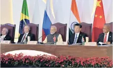  ??  ?? From left, Brazilian President Michel Temer, Russian President Vladimir Putin, Indian Prime Minister Narendra Modi, Chinese President Xi Jinping and President Jacob Zuma at the 8th Brics Summit in India last week.