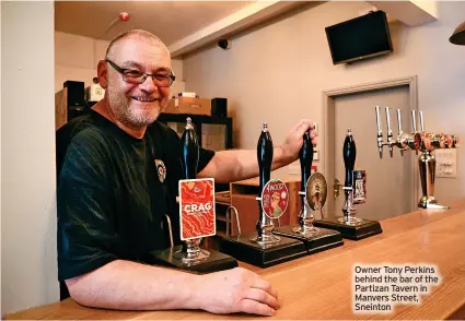  ?? ?? Owner Tony Perkins behind the bar of the Partizan Tavern in Manvers Street, Sneinton