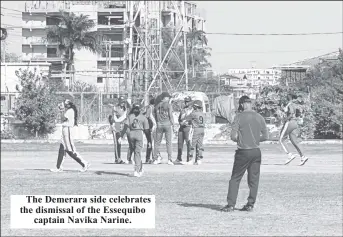  ?? ?? The Demerara side celebrates the dismissal of the Essequibo captain Navika Narine.