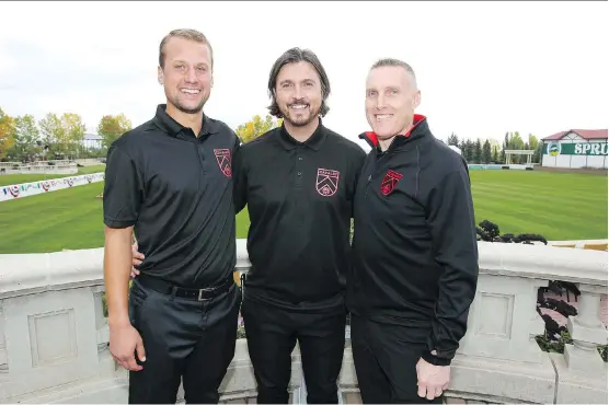  ?? JIM WELLS ?? Cavalry FC head coach and GM Tommy Wheeldon Jr., centre, with goalkeeper coach Jordan Santiago, left, and assistant coach and technical director Martin Nash on Tuesday.