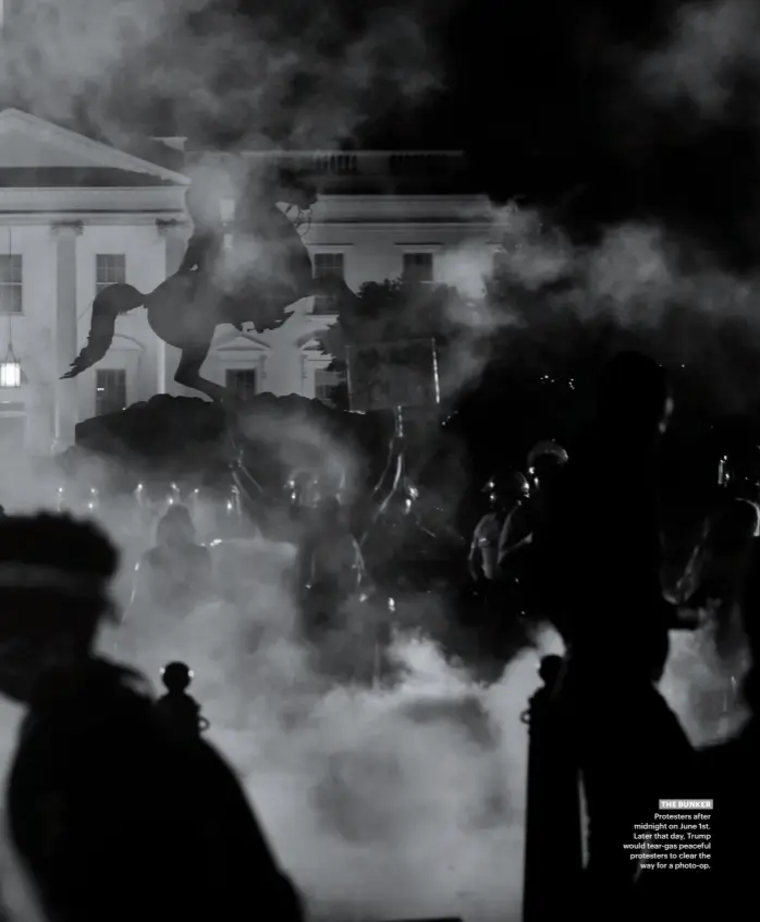  ??  ?? THE BUNKER
Protesters after midnight on June 1st. Later that day, Trump would tear-gas peaceful protesters to clear the
way for a photo-op.